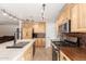 Bright kitchen with island seating and stainless steel appliances at 8755 E Portobello Ave, Mesa, AZ 85212