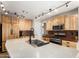 Modern kitchen with stainless steel appliances, granite countertops, and custom cabinetry at 8755 E Portobello Ave, Mesa, AZ 85212