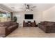 Spacious living room with tile floors, ample seating, and media center at 8755 E Portobello Ave, Mesa, AZ 85212