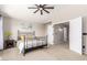 Comfortable bedroom featuring a ceiling fan and easy access to the closet at 8755 E Portobello Ave, Mesa, AZ 85212