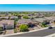 Wide aerial view of a well-planned community and a single-story home with a desert landscape at 9253 W Sands Dr, Peoria, AZ 85383