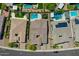 High angle aerial view of a single Gathering home with a pool and trampoline in a residential neighborhood at 9253 W Sands Dr, Peoria, AZ 85383