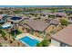 Aerial shot of a backyard with a pool, trampoline, and landscaped yard, creating a serene escape at 9253 W Sands Dr, Peoria, AZ 85383