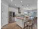 Spacious kitchen with large island, stainless steel appliances, and white shaker cabinets at 9253 W Sands Dr, Peoria, AZ 85383