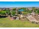 A playground is surrounded by mature trees in this scenic neighborhood park at 9253 W Sands Dr, Peoria, AZ 85383