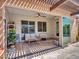 Inviting covered patio with comfortable seating and sliding glass doors to the home and private pool at 9253 W Sands Dr, Peoria, AZ 85383