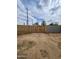 Backyard shows a wooden gate set within a concrete block fence at 9601 N 35Th Dr, Phoenix, AZ 85051