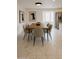 Elegant dining room featuring a modern table set and stylish tile flooring at 9601 N 35Th Dr, Phoenix, AZ 85051