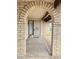 Charming entrance featuring an arched doorway and inviting welcome mat at 9601 N 35Th Dr, Phoenix, AZ 85051