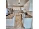 Bright kitchen featuring granite countertops, new appliances, and tile flooring at 9601 N 35Th Dr, Phoenix, AZ 85051