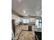 Bright kitchen featuring granite countertops, new appliances, and tile flooring at 9601 N 35Th Dr, Phoenix, AZ 85051