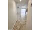 Bright open-plan living area with marble flooring and stainless steel kitchen appliances at 9601 N 35Th Dr, Phoenix, AZ 85051