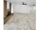 Spacious living room featuring stunning tile flooring and classic brick fireplace at 9601 N 35Th Dr, Phoenix, AZ 85051