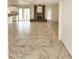 Open living area with a fireplace, tile floors and access to the back yard at 9601 N 35Th Dr, Phoenix, AZ 85051