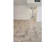 Bright living area featuring tile floors, white walls, and a hallway at 9601 N 35Th Dr, Phoenix, AZ 85051