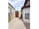 Side yard features a concrete path, gate and partial view of adjacent homes at 9601 N 35Th Dr, Phoenix, AZ 85051