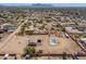 Wide aerial view showing desert property line, showcasing home, pool, and ample space for parking at 9713 E El Paso St, Mesa, AZ 85207