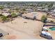 Expansive desert lot with a well-maintained home, pool, and plenty of space for recreation and RV parking at 9713 E El Paso St, Mesa, AZ 85207