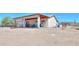 Covered back patio with ceiling fan overlooking spacious desert lot at 9713 E El Paso St, Mesa, AZ 85207