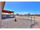 Spacious fenced backyard features a covered patio, pool, and ample space for outdoor activities and relaxation at 9713 E El Paso St, Mesa, AZ 85207