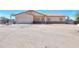 Front of a single-story house with a two-car garage, covered entrance, and desert landscaping at 9713 E El Paso St, Mesa, AZ 85207