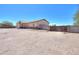 Side view of home shows large lot with block wall and plenty of space for parking or storage at 9713 E El Paso St, Mesa, AZ 85207