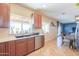 Bright kitchen with stainless steel appliances, spacious countertops, and a view of the living area at 9713 E El Paso St, Mesa, AZ 85207