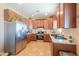 Well-equipped kitchen featuring stainless steel appliances, ample counter space, and modern cabinetry at 9713 E El Paso St, Mesa, AZ 85207