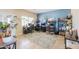 Spacious office space with tiled flooring, multiple desks, and ample natural light, ideal for a productive work environment at 9713 E El Paso St, Mesa, AZ 85207