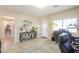 Bright office space with tile floors, a large window, and neutral walls creating a productive and inviting workspace at 9713 E El Paso St, Mesa, AZ 85207