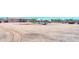 Large backyard with a water feature, offering ample space and potential for landscaping and outdoor activities at 9713 E El Paso St, Mesa, AZ 85207