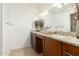 Bright bathroom with granite countertops, a double sink vanity, and neutral decor at 9809 W Behrend Dr, Peoria, AZ 85382