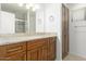Modern bathroom vanity with granite countertop, storage cabinets, and walk-in shower at 9809 W Behrend Dr, Peoria, AZ 85382