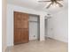 Neutral bedroom featuring a ceiling fan and spacious closet with sliding doors at 9809 W Behrend Dr, Peoria, AZ 85382