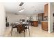 Open kitchen with stainless steel appliances, granite countertops, and a center island at 9809 W Behrend Dr, Peoria, AZ 85382