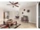 Bright living room with a ceiling fan, modern decor, and an open floorplan at 9809 W Behrend Dr, Peoria, AZ 85382