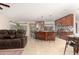Open concept living area featuring a modern kitchen, inviting living room, and adjacent dining space at 9809 W Behrend Dr, Peoria, AZ 85382