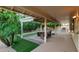 Inviting covered patio with fire pit, seating area, and outdoor grill at 9809 W Behrend Dr, Peoria, AZ 85382