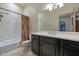 Well-lit bathroom featuring a vanity with a bath and shower at 9847 E Preserve Way, Scottsdale, AZ 85262