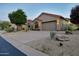 Single Gathering home featuring desert landscaping, a two car garage and barrel tile roof at 9847 E Preserve Way, Scottsdale, AZ 85262