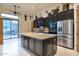 Spacious kitchen with an island, stainless steel appliances, and stylish tile flooring at 9847 E Preserve Way, Scottsdale, AZ 85262