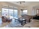 Cozy living room with comfortable seating, a large window, and a stylish area rug at 9847 E Preserve Way, Scottsdale, AZ 85262