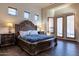 Elegant bedroom featuring a decorative bed frame and ample natural light at 9847 E Preserve Way, Scottsdale, AZ 85262