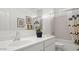 Bathroom with tub/shower combo and modern shower curtain with a light and bright feel at 10524 W Bloch Rd, Tolleson, AZ 85353