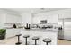 Well-appointed kitchen with white cabinets, granite countertops, a center island, and stainless steel appliances at 10524 W Bloch Rd, Tolleson, AZ 85353