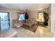 Cozy living room with tile floors, comfortable seating, and ample natural light at 10705 W Montecito Ave, Phoenix, AZ 85037