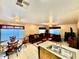 Open-concept living and dining area with tile flooring, natural light, and comfortable seating at 10705 W Montecito Ave, Phoenix, AZ 85037