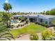 Aerial view of home showcasing the lush backyard, pool, and well-maintained landscaping at 11717 E Estrella Ave, Scottsdale, AZ 85259