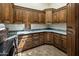 Well-organized laundry room featuring extensive cabinetry, granite countertops, and a sink at 11717 E Estrella Ave, Scottsdale, AZ 85259