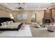 Spacious main bedroom featuring a cozy fireplace and sitting area for relaxation at 11717 E Estrella Ave, Scottsdale, AZ 85259
